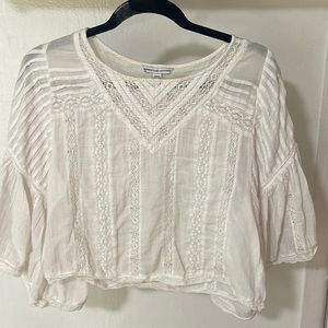 American Eagle white flowy top. Size medium.